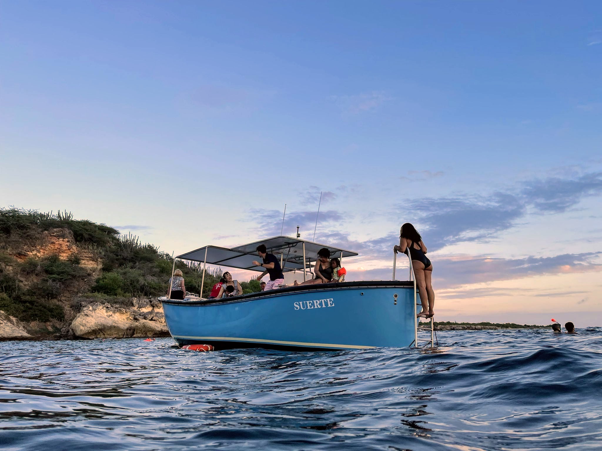 Tommy Coconut Sunset Boat